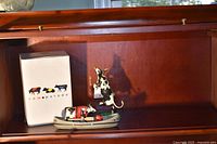 Overall view showing both figurines and CowParade box