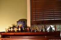 Overall view of figurines on shelf with bucket