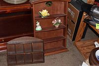 Overall view of both wooden shelves and figurines