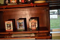 Three boxed Budweiser holiday steins on shelf