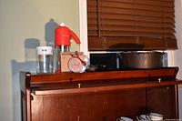 Overall lot showing kettle, chopper, measuring cup, ornament box, utensils