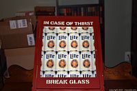 Front view showing sign text and Miller Lite can graphics