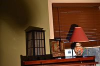 Shoji lamp, porcelain lamp with red shade, jewelry chest on dresser