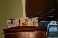 Five sealed Creative Woman craft kits lined up