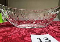 Side view showing etched leaf design and faceted rim of crystal bowl