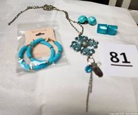 Full lot showing necklace and three earring sets