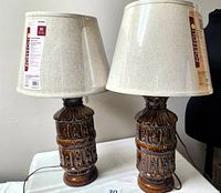 Both ceramic lamps with shades visible front view