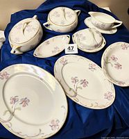 Full set arranged on blue cloth, showing all pieces