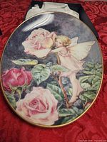 Front view showing Rose Fairy design and gold rim
