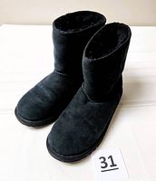 Front and side view of both black UGG boots