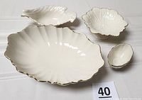 All four Lenox ivory bowls grouped