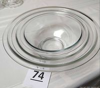 Three clear Pyrex bowls nested together