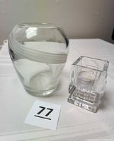 Vase and Waterford Metropolitan votive holder side by side with lot number
