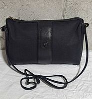 Front view showing full bag, strap, shape and canvas material