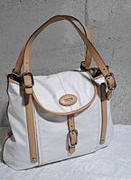 front view showing flap, buckles, handles and overall condition