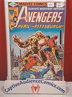 Front view of Avengers #192 comic book in protective sleeve on display stand