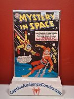 Front cover of Mystery in Space #94 in protective sleeve on stand