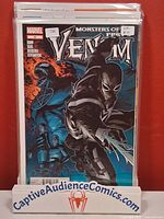 Front view of Venom #25 comic, bagged and boarded in display stand