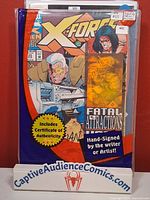 Front view of bagged and boarded X-Force #25 with COA notice and hand-signed label visible