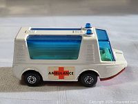 Left side view showing ambulance decal, wheels, body colour