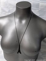 Necklace displayed on bust showing full drop and pendant