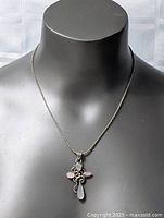 Necklace on display bust showing overall length and pendant drop