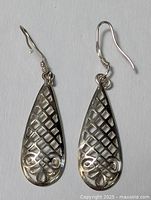 Front view of the two teardrop earrings showing lattice design
