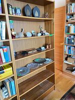 Front view of full bookcase with shelves