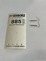 Earrings with lot label for scale