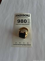 Ring with MaxSold lot tag showing overall appearance