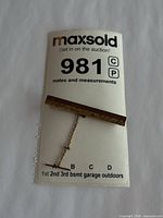 Tie bar on MaxSold lot card showing overall view