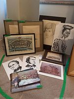 Group shot showing framed bird prints, map print, and unframed drawings