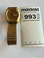 Front view of Heloisa wristwatch beside lot card