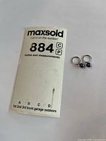 Lot overview showing both hoop earrings beside lot card