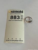 Ring beside lot card showing overall appearance