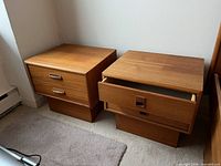 Front view of both nightstands showing drawers and pulls