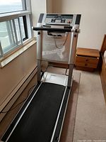 Full view of Tempo Fitness Evolve treadmill setup by window