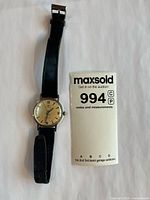 Full view of watch with strap and scale card