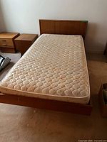 Full view of twin bed frame with mattress in place