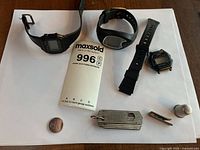 All items overview: three watches, tie clip, thimble, razor