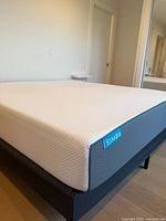 Simba king mattress on frame showing tag