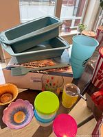 overview of silicone loaf pans, spatula, storage tubs and small bowls