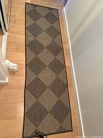 Runner rug full length showing diamond pattern