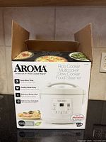 Front of Aroma box showing product image and functions