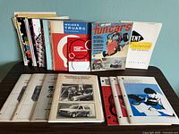 Full lot of manuals and magazines displayed on table