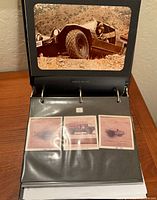 Binder open displaying mounted 8x10 color photo of Lamborghini Cheetah and sleeve with smaller photos