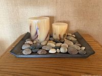 Overview of slate tray with candles and rocks