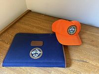 Cap and organizer displayed on table