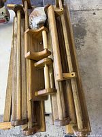 Stacked wooden railings, grab handles, toilet paper holder visible