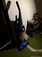 Full view of Bissell PowerForce upright vacuum standing on floor